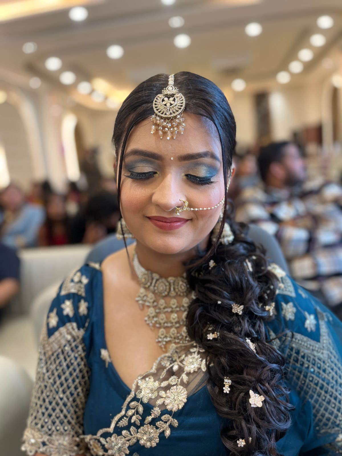 Close bridal beauty portrait with defined eye makeup.