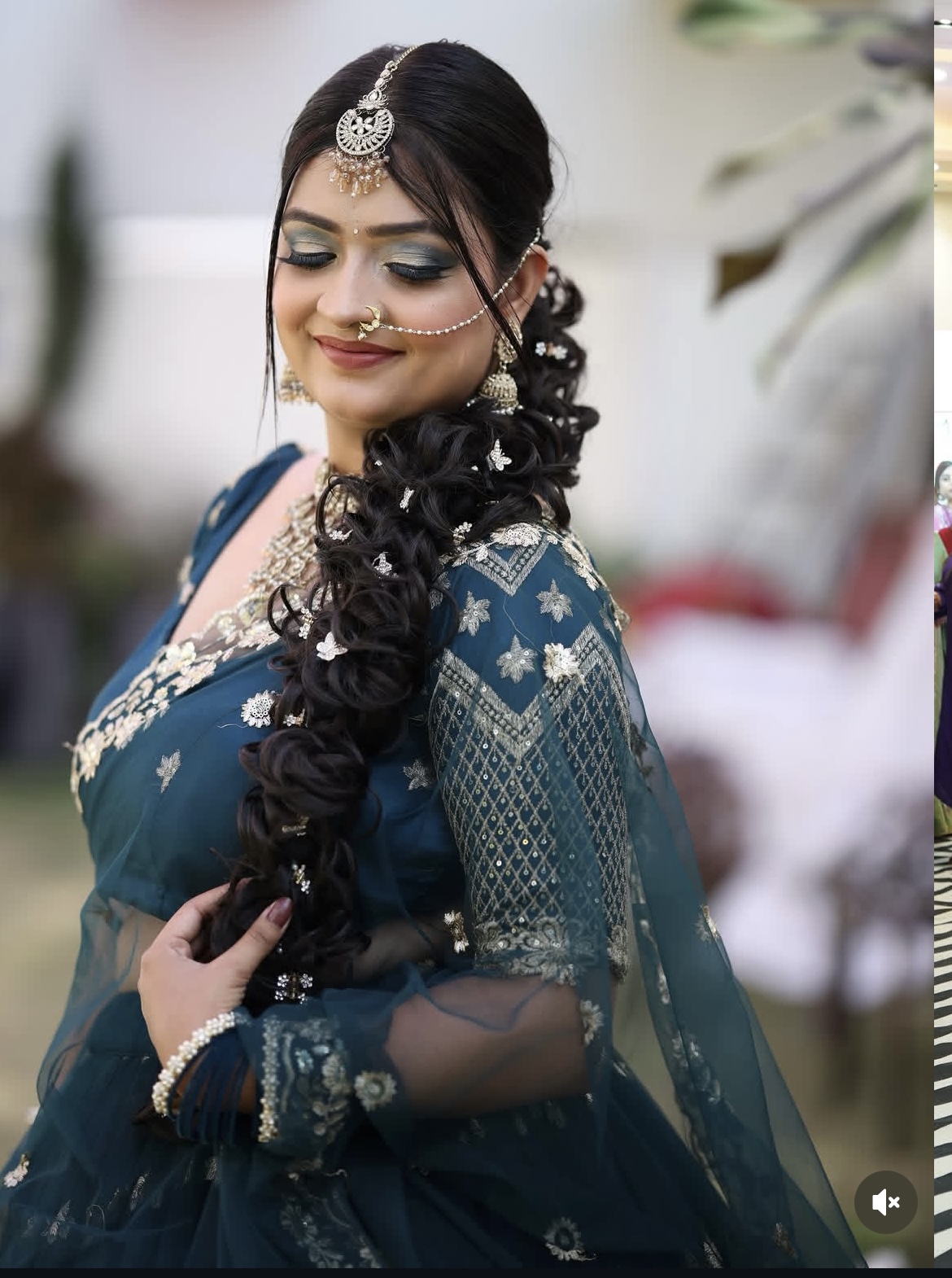 Bridal portrait with detailed braid and makeup styling.